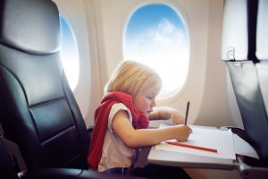 With these airplane travel tips your kid will manage the flight just fine – and so will you!